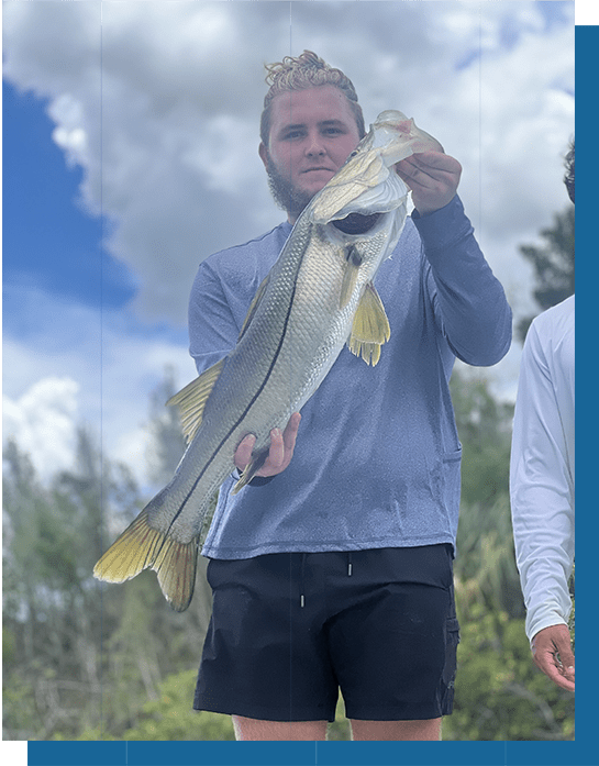 Tyson Holding a Snook Fish