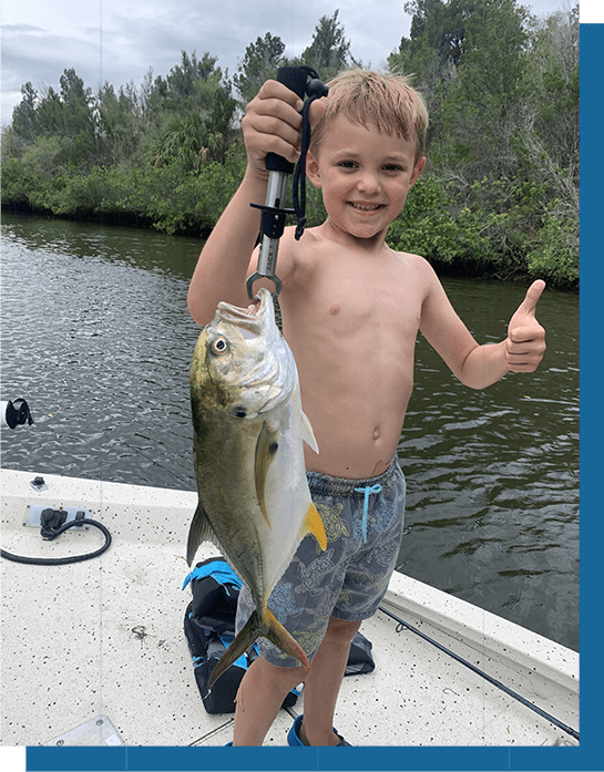 Little Kid Holding a Jack Fish