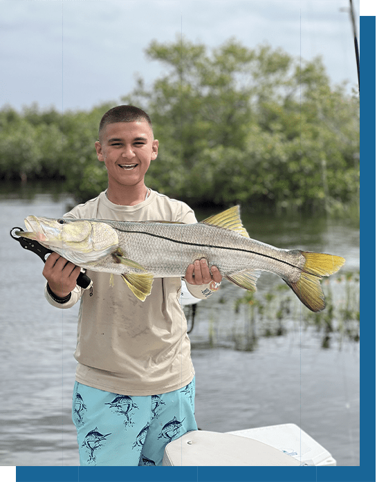 Blayne Holding a Snook Fish