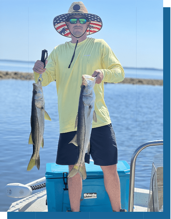 Taylor with Two Snook Fish