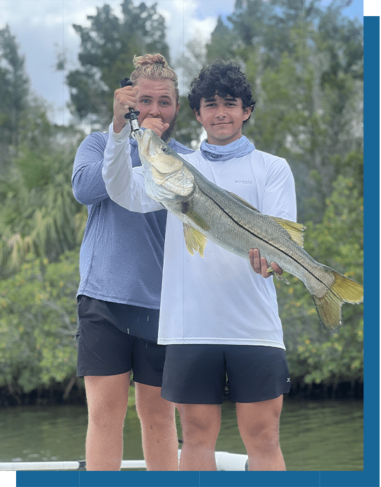 Vance and Tyson Posing with a Snook