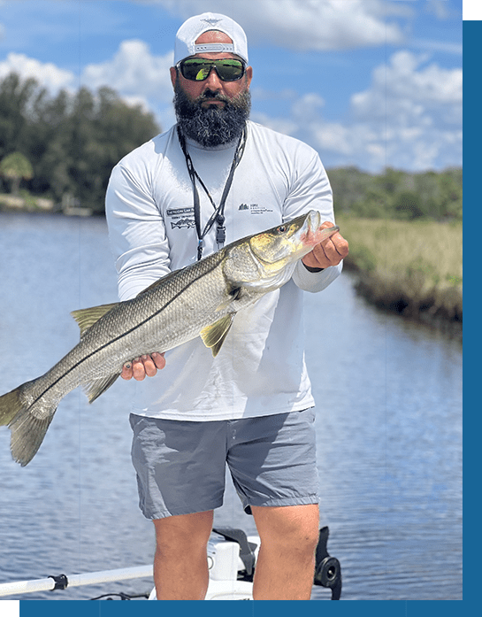 Wayne Holding a Snook Fish