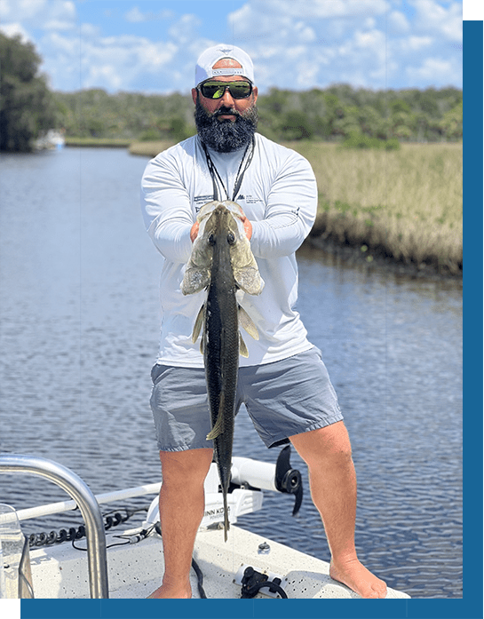 Wayne Holding a Snook Fish