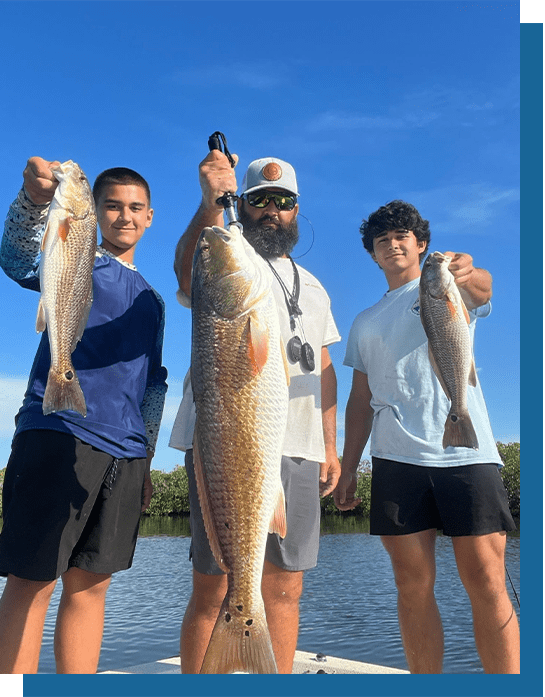 Wayne, Vance and Blayne Holding Some Redfish